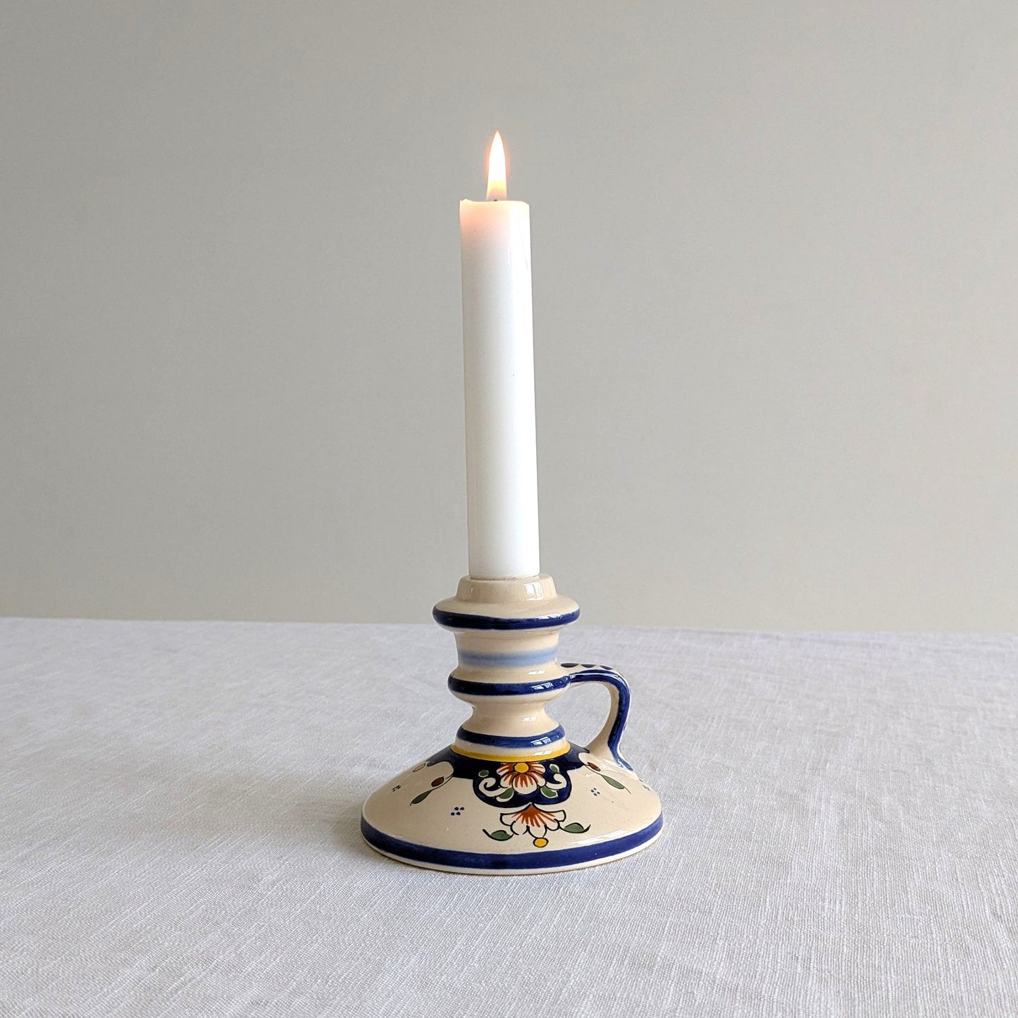 French hand painted candle holder with lit candle