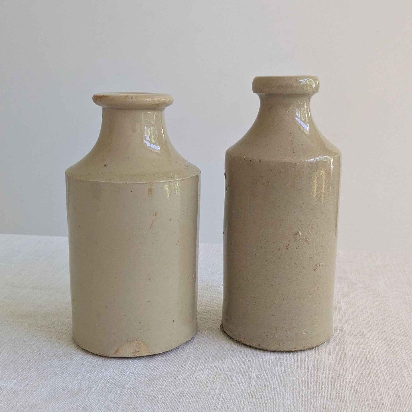 Antique Stoneware Bottle Pair