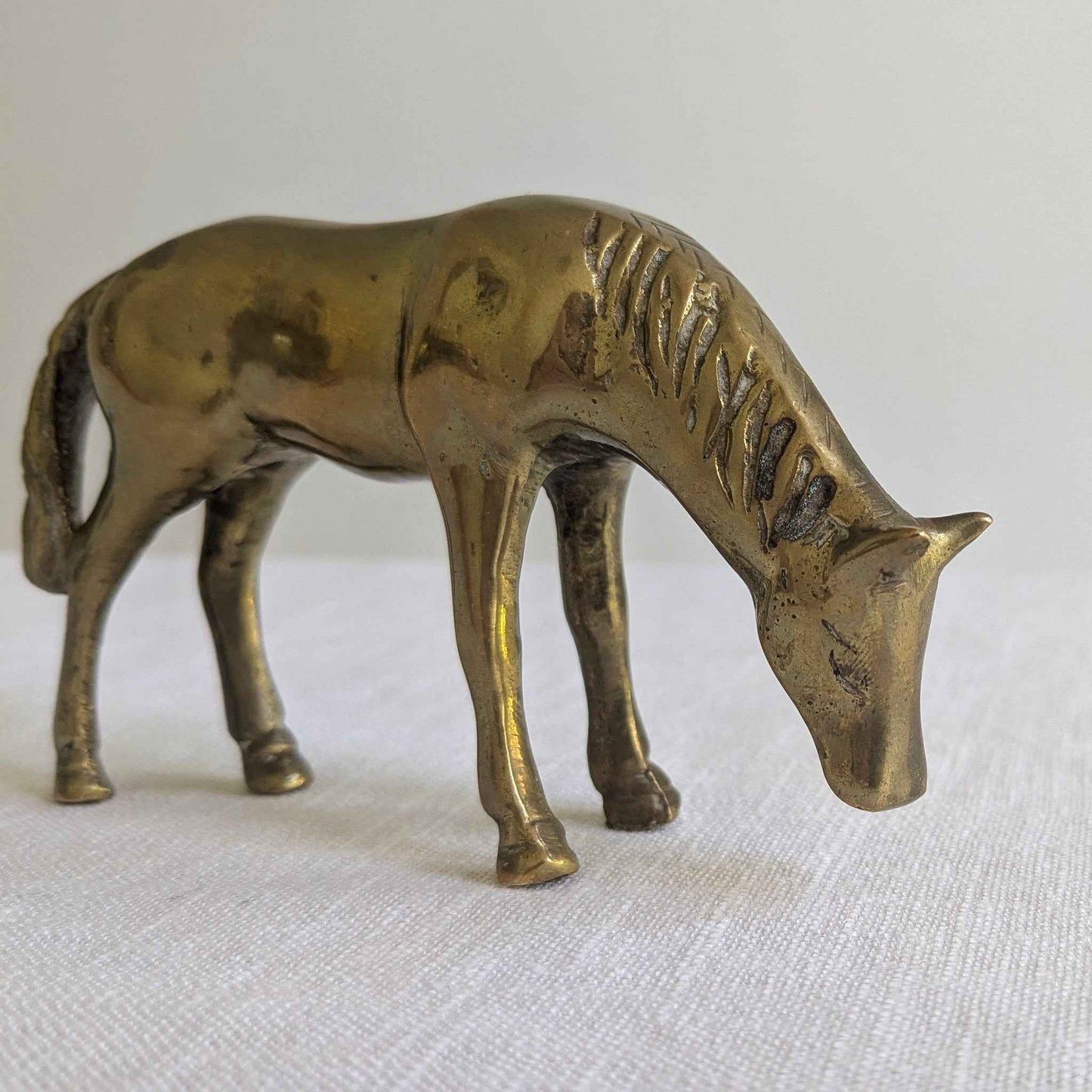 Brass Grazing Horse