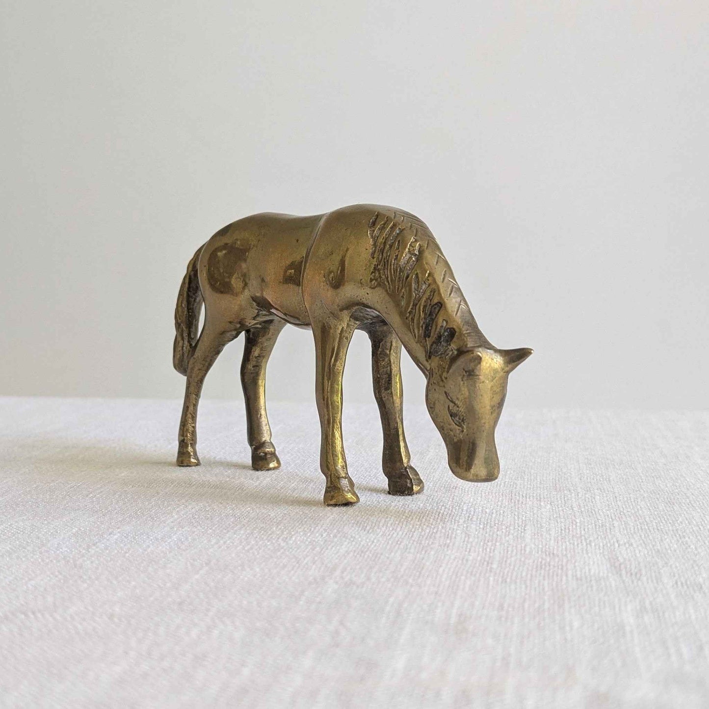 Brass Grazing Horse