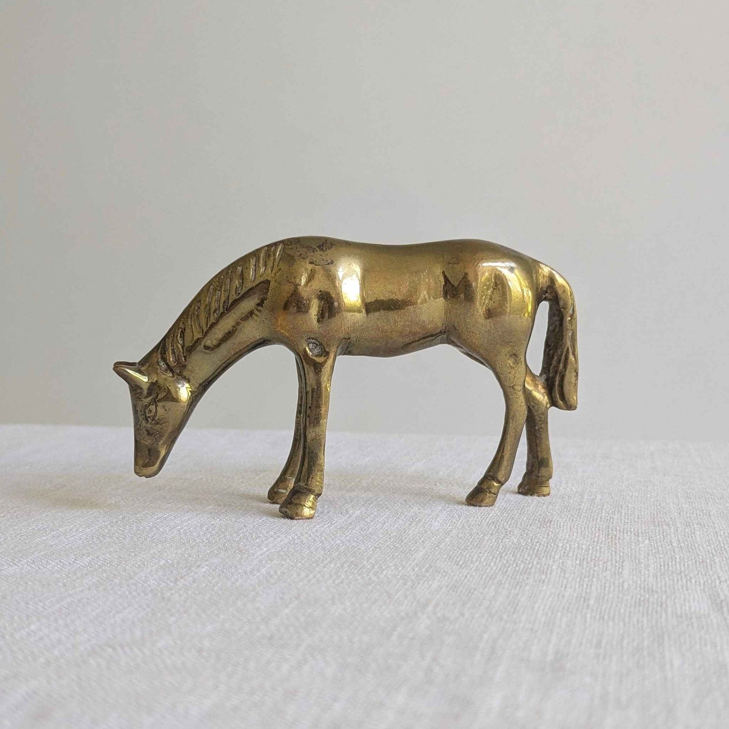 Brass Grazing Horse