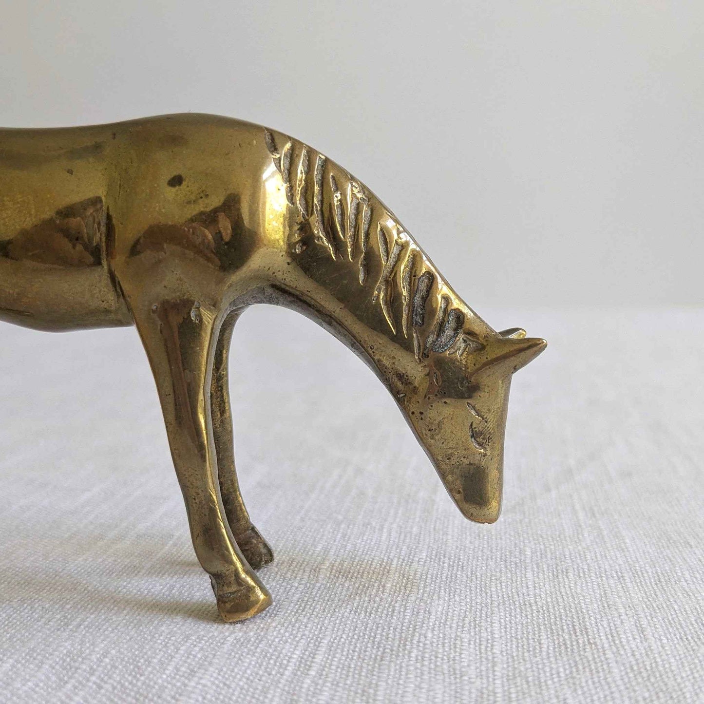 Brass Grazing Horse